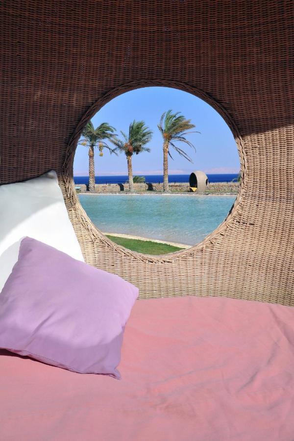 Retac Qunay Dahab Resort & Spa Exterior foto View of the pool at the hotel